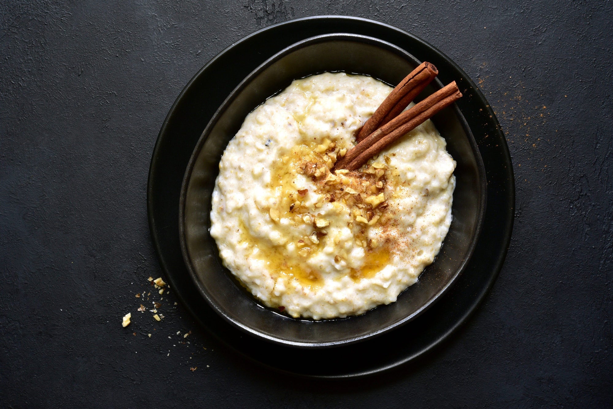 Porridge / oats in a bowl with cinnamon honey and nuts