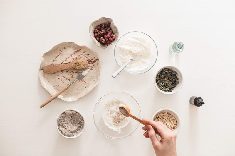 bowls with different ingredients in preparation to make a DIY face mask